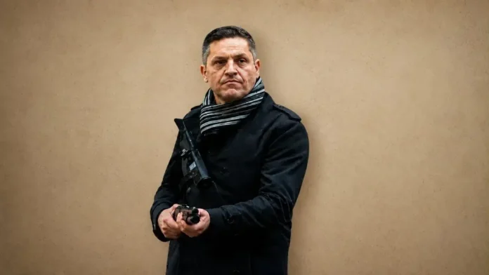 Gustavo Antonio Gauna, Comisario Inspector de la Policía Federal Argentina (PFA). De civil en la marcha contra la Ley de Tierras.